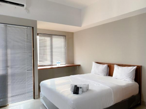 Homey and Minimalist Studio Gateway Park LRT City Bekasi Apartment By Travelio